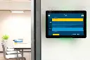 Portrait room panel with green LED beside glass meeting room.webp